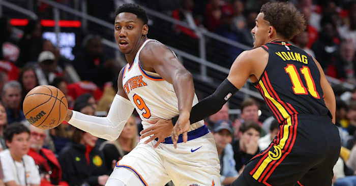 New York Knicks guard RJ Barrett defended by Atlanta Hawks guard Trae Young.